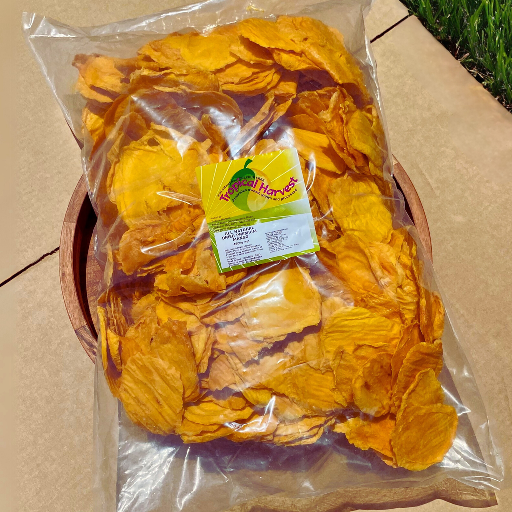 Close-up of a 4.5kg bulk pack of premium Australian dried mango from Tropical Harvest, sealed in a clear plastic bag, showing golden mango slices. Packaged for freshness and quality.