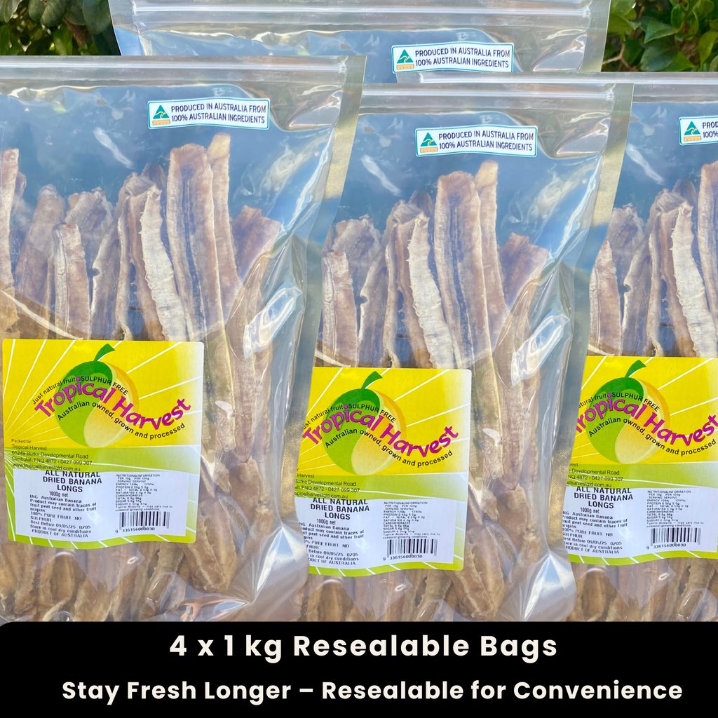 Four 1kg resealable bags of Australian dried banana longs, displayed outdoors with a bright background. Naturally sweet and chewy, with no added sugar or preservatives. Bulk 4kg pack for freshness and convenience