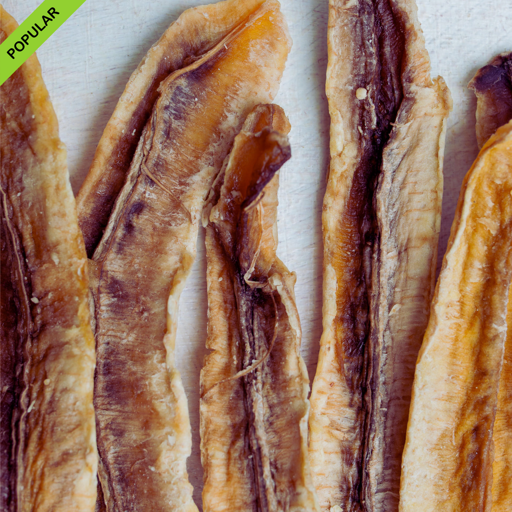 Close-up of Australian dried banana longs, showing their rich caramel-like texture and natural variation. Popular bulk snack, naturally sweet with a chewy texture.