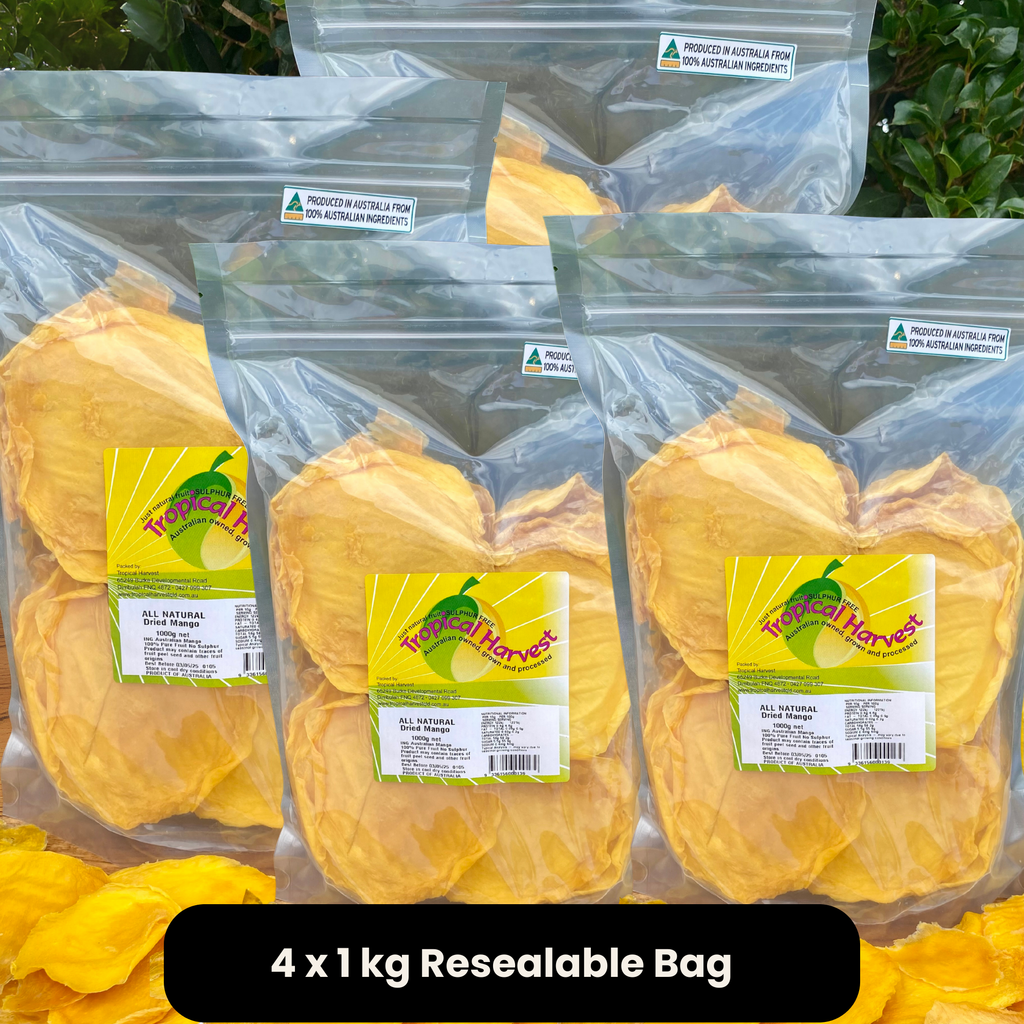 Four 1kg resealable bags of premium 4kg bulk dried mango from Tropical Harvest, displayed outdoors, naturally sweet, 100% Australian, additive-free.