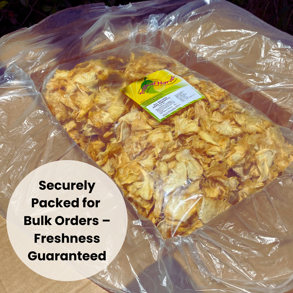 A securely packed bulk order of Australian dried pineapple inside a protective plastic bag and cardboard box. The label highlights the 100% natural, additive-free dried fruit, ensuring freshness for wholesale buyers